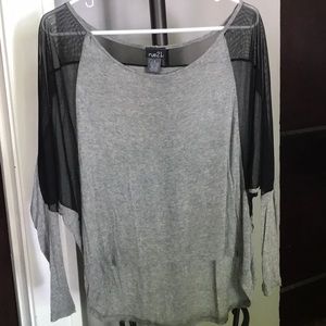 Dressy high/low mesh top.